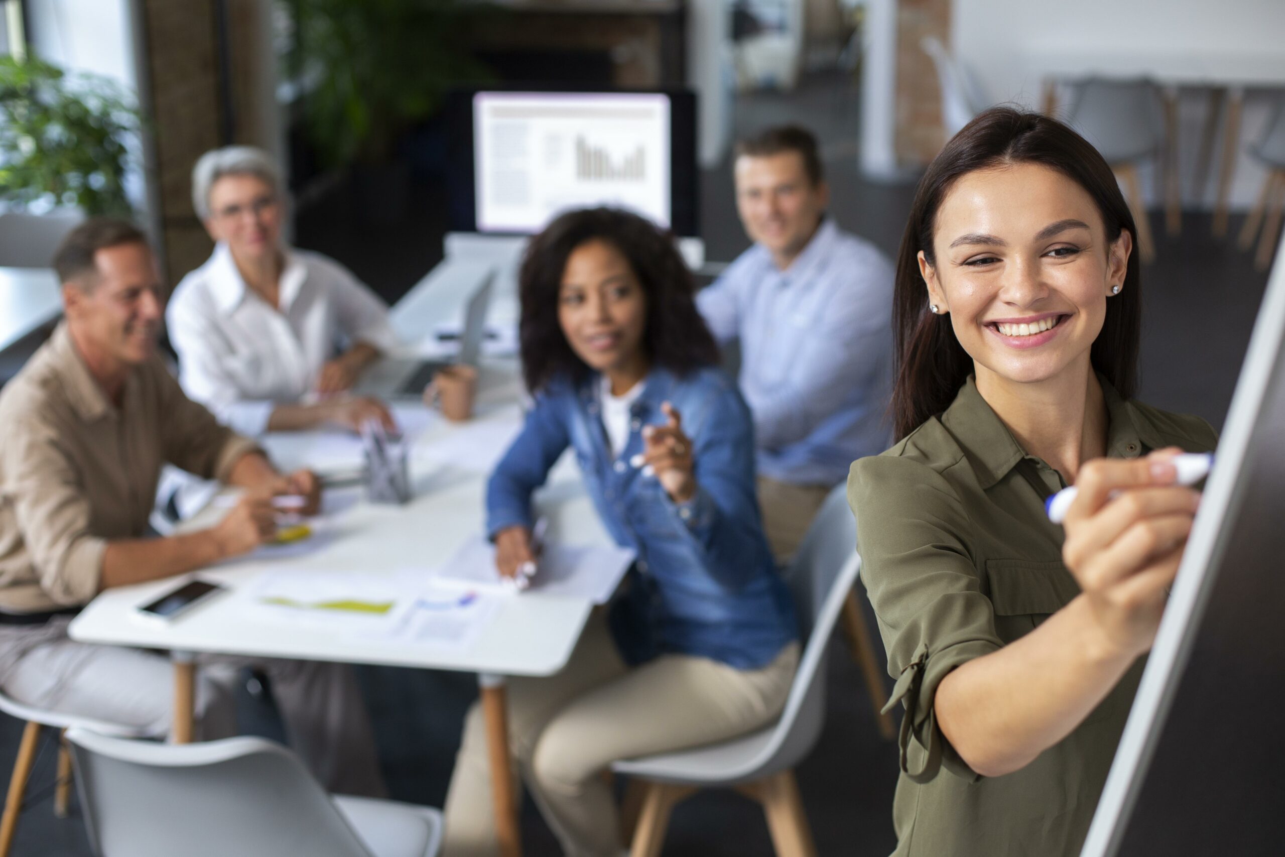 people using digital device while meeting scaled